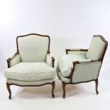A pair of Louis XVI style walnut-framed upholstered salon chairs, modern Upholstery is slightly