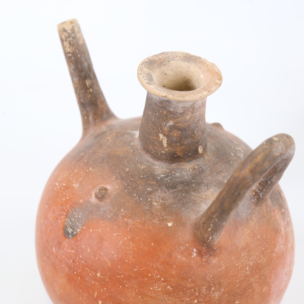 An Ancient terracotta globular redware flagon, height 18cm, and an Ancient Greek blackware 2-handled - Image 4 of 4