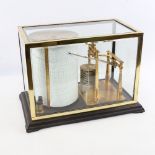 A Tycos brass-mounted barograph, by Short & Mason of London, in brass case with bevel-glass