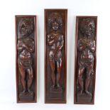 3 18th century high relief carved and stained wood panels, depicting standing Classical figures,