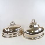 2 19th century oval silver plated meat covers with cast handles, length 40cm (2) Both in good