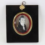 A Regency miniature painting on ivory, portrait of a gentleman wearing a black coat with stock,