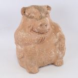 An unusual terracotta Tribal flagon in the form of a grotesque seated figure, height 28cm The top