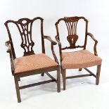 2 George III mahogany elbow chairs with carved backs