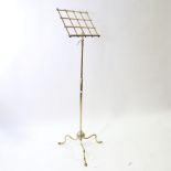 A Victorian brass music stand on tripod base with telescopic adjustment, max height 155cm