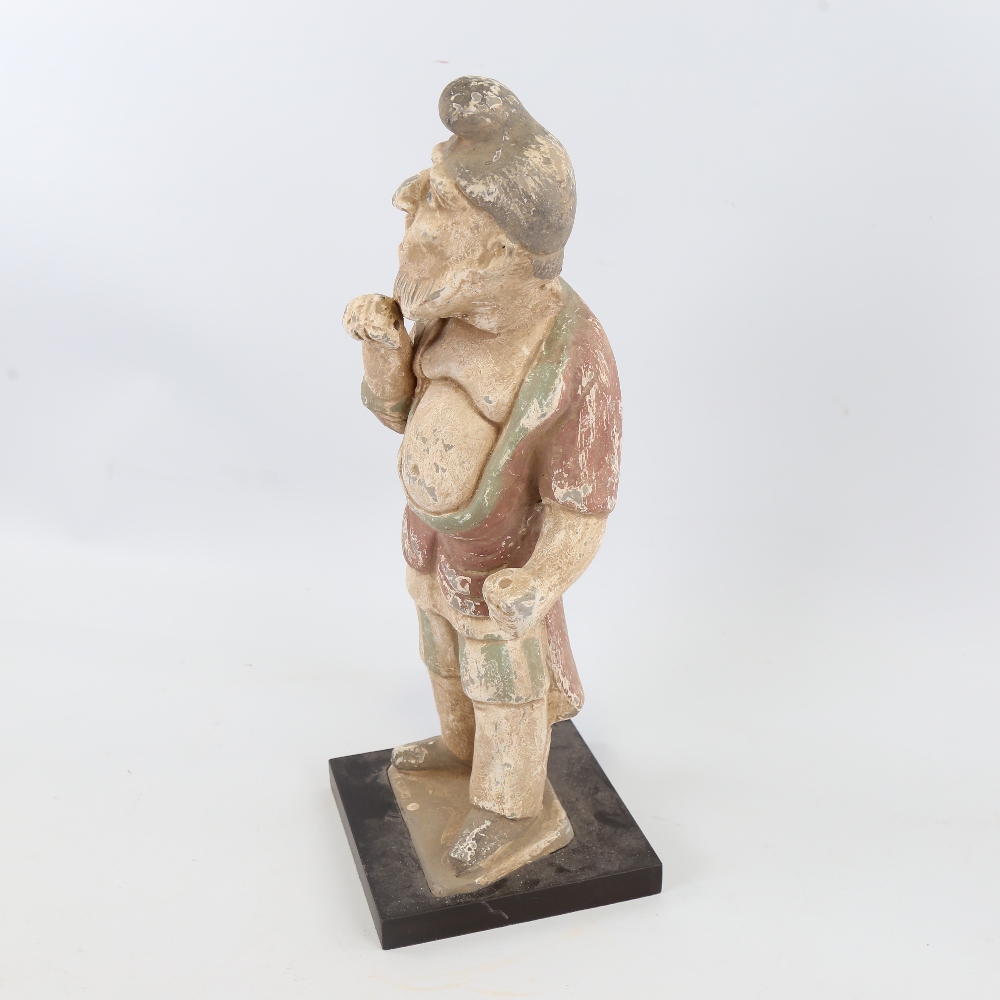 An Indian/Chinese painted terracotta standing figure wearing a turban, on wood plinth, height 41cm - Image 3 of 4