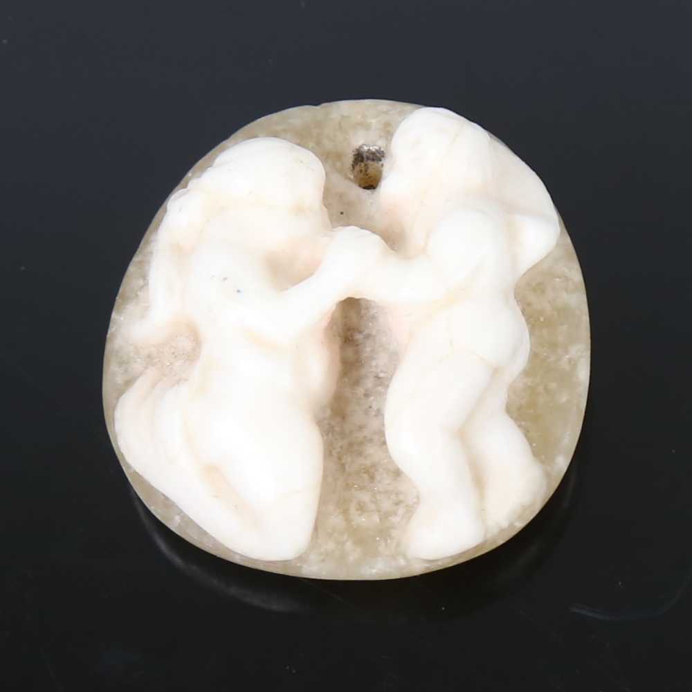 A Roman cameo carved hardstone pendant, in natural 2-colour stone, depicting 2 Classical figures,