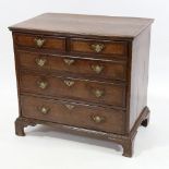 A Georgian oak and mahogany crossbanded chest of 3 long and 2 short drawers of small size, width