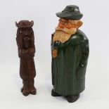 A 19th century Black Forest carved wood figural nutcracker, length 21cm, and a carved and painted