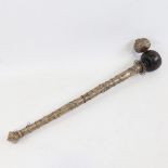 An Oriental unmarked white metal ceremonial pipe with wooden bowl, length 38cm