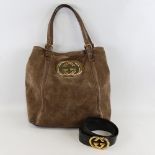 GUCCI - a brown suede and leather shoulder bag with gilt monogram badge, length approx 40cm,