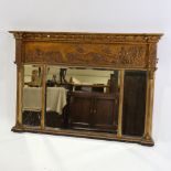 An early 19th century gilt-gesso framed triple-glass over mantel mirror, with ball pediment,