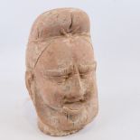 An Indian/Chinese terracotta life-size head wearing a turban, height 28cm A number of minor chips