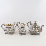 An ornate 19th century electroplate 3-piece melon-shaped tea set, with chased relief floral