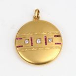 An early 20th century 14ct gold ruby and diamond photo locket pendant, set with old European-cut