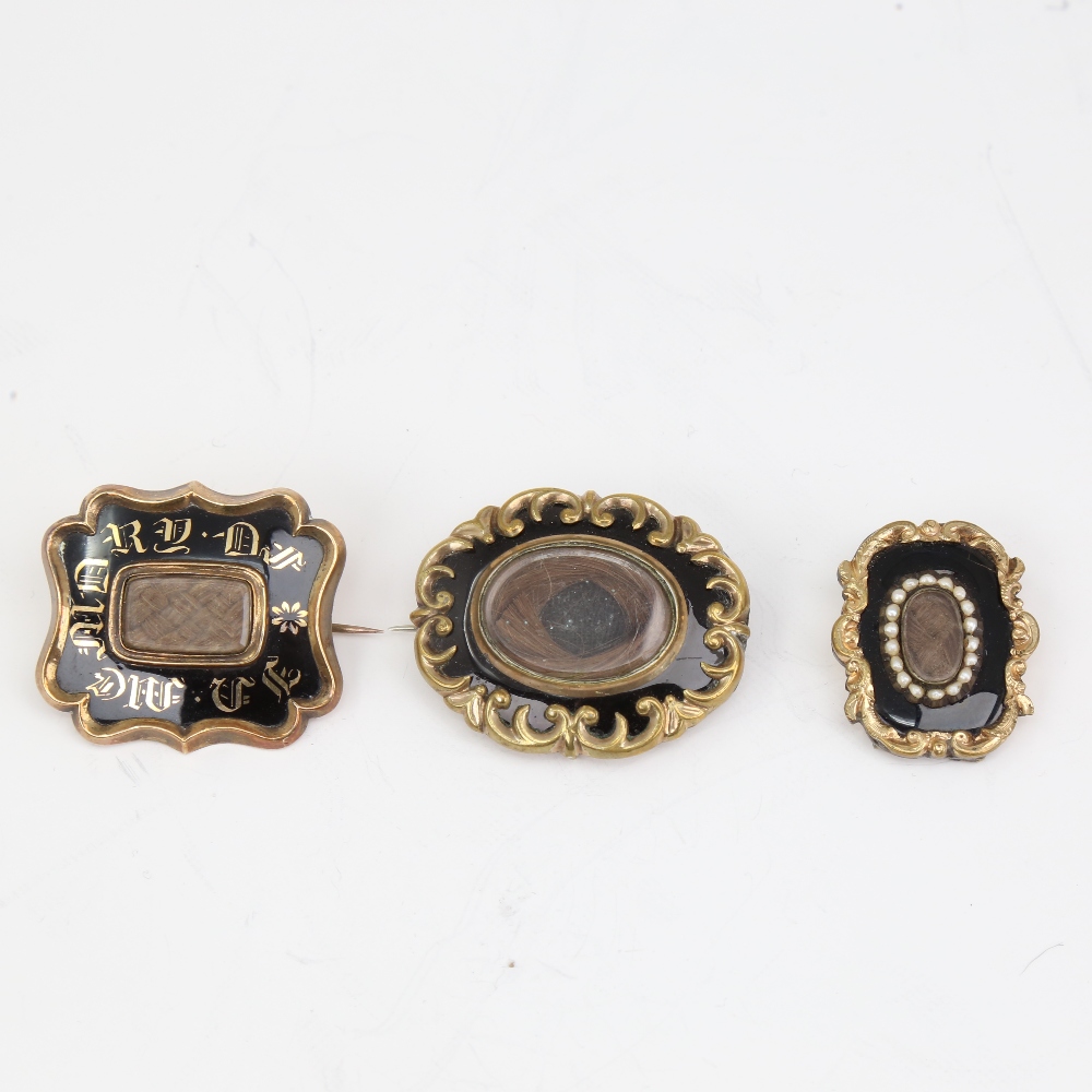 3 Victorian black enamel mourning brooches, unmarked yellow metal settings with central hair panels,