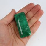 A 284ct unmounted rectangular emerald step-cut emerald, dimensions: 55.00mm x 25.00mm x 22.00mm,