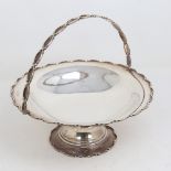 A George V silver swing-handled fruit bowl, circular pedestal form with scalloped rim, by William