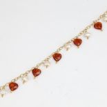 A modern 9ct gold amber and pearl drop bracelet, bracelet length 19cm, 6.3g No damage or repair,
