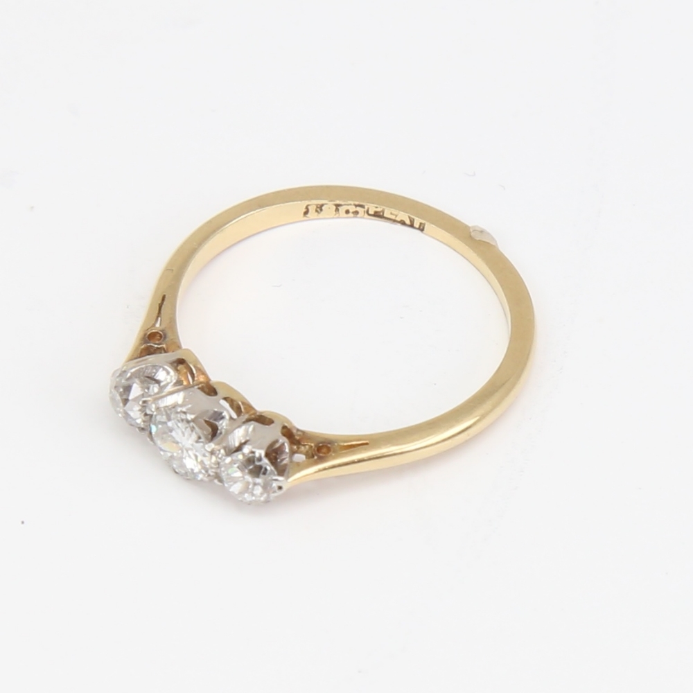 An early 20th century 18ct gold 3-stone diamond ring, set with round brilliant and old-cut diamonds, - Image 4 of 5