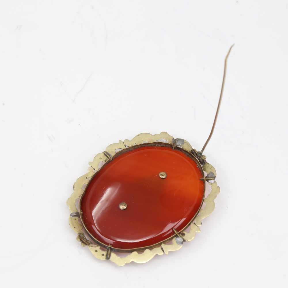 A large Victorian oval mourning brooch, unmarked yellow metal settings with red banded agate and - Image 3 of 5