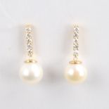 A modern pair of 14ct gold whole Southsea cultured pearl and diamond drop earrings, set with