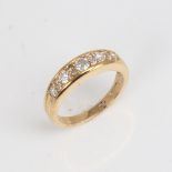 A modern 9ct gold diamond half hoop ring set with round brilliant and eight-cut diamonds, total