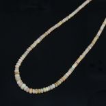 An Australian fire opal bead necklace, with sterling silver clasp, necklace length 47cm, 12.4g No