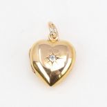 A Victorian 18ct gold diamond set heart locket pendant, set with old-cut diamond and 15ct bale,