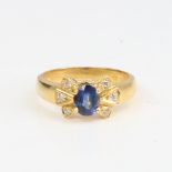A modern handmade 18ct gold cornflower blue sapphire and diamond dress ring, set with oval mixed-cut