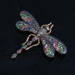 An silver-gilt gem set figural dragonfly brooch, gemstones include sapphires emeralds and