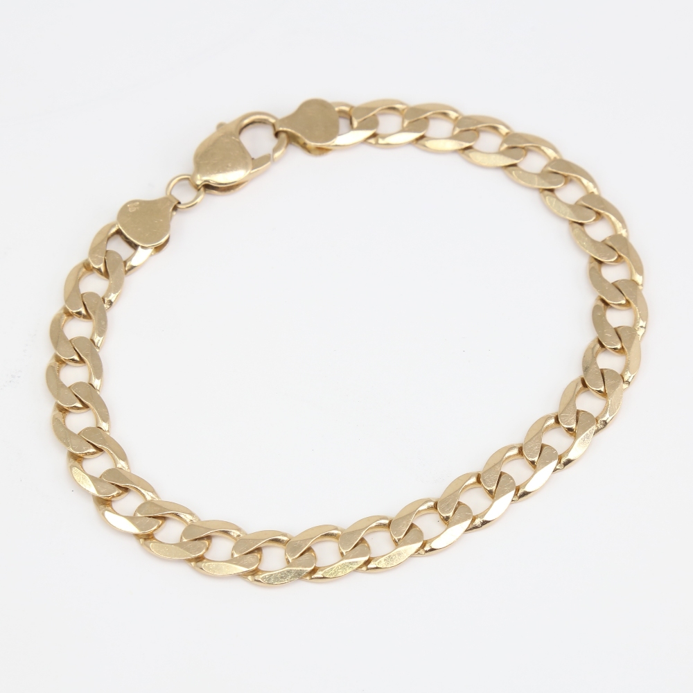 A late 20th century 9ct gold flat curb link bracelet, bracelet length 22cm, 18.9g No damage or - Image 2 of 5