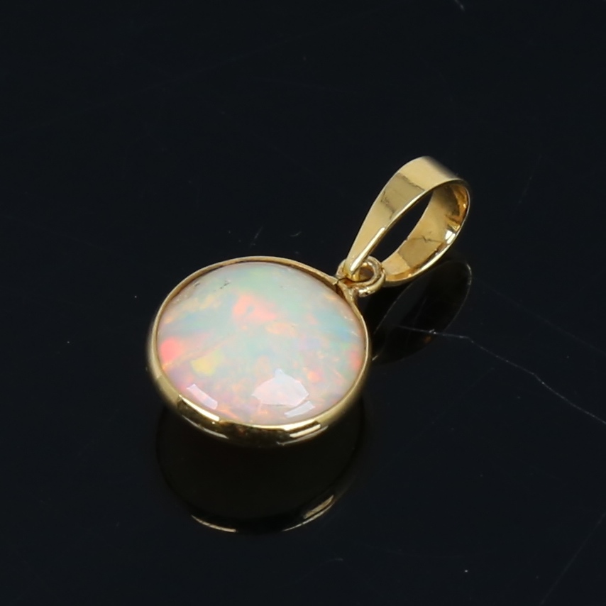 A modern handmade unmarked gold Ethiopian opal pendant, set with round cabochon opal, settings - Image 2 of 5