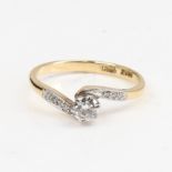 An 18ct gold 0.25ct solitaire diamond ring, crossover settings with central modern round brilliant-