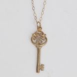 A modern 9ct gold 18th birthday key pendant necklace, on 9ct trace link chain, pendant height 28.