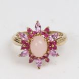 A modern 9ct gold rose quartz ruby and pink sapphire cluster snowflake dress ring, set with oval