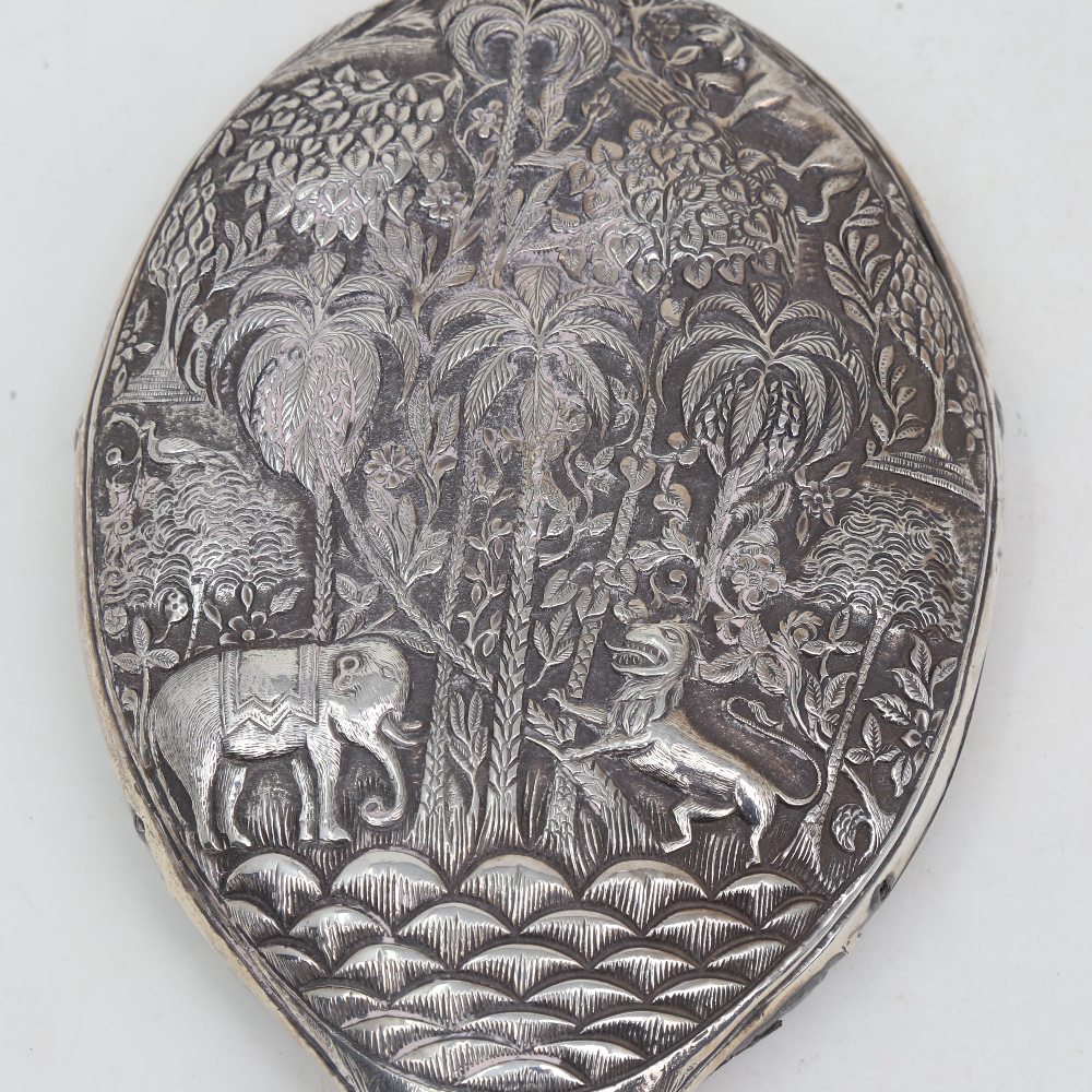 An unmarked Indian silver dressing table hand mirror, allover relief embossed animal and jungle - Image 2 of 5