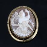 A Victorian relief carved shell cameo swivel brooch, depicting Bacchante lady with lion pelt and
