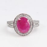 A modern 14ct white gold pink sapphire and diamond cluster ring, set with oval mixed-cut sapphire