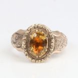 An Antique unmarked gold citrine memorial ring, set with 1.62ct oval mixed-cut citrine, with