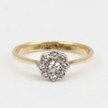An 18ct gold diamond cluster flowerhead ring, set with old European and old-cut diamonds with