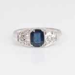 A French Art Deco style 18ct white gold 3-stone sapphire and diamond ring, geometric panel set
