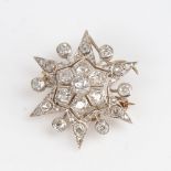 A Victorian unmarked gold diamond cluster starburst brooch, set with old and rose-cut diamonds,