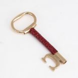 CARTIER - a Vintage 9ct gold and red leather key pendant, signed and numbered 76961, hallmarks