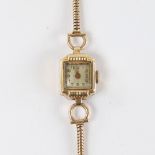 A lady's Vintage 14ct gold mechanical wristwatch, on 9ct snake link strap, not currently working,