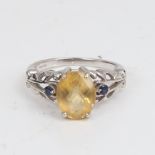 A modern 9ct white gold citrine and sapphire dress ring, citrine length 10mm, size N, 4.5g No damage