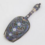 A Russian silver and champleve enamel sugar shovel, mark of Antip Kuzmichev of Moscow, made for