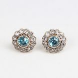 A pair of unmarked gold blue and white zircon cluster stud earrings, earring diameter 12.6mm, 3.5g
