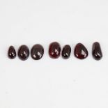 A group of unmounted cabochon garnets, approx 63.8ct total, largest length 17.6mm, 12.8g total (7)