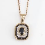A modern 9ct gold sapphire and diamond pendant necklace, on 9ct trace figaro link chain, pendant